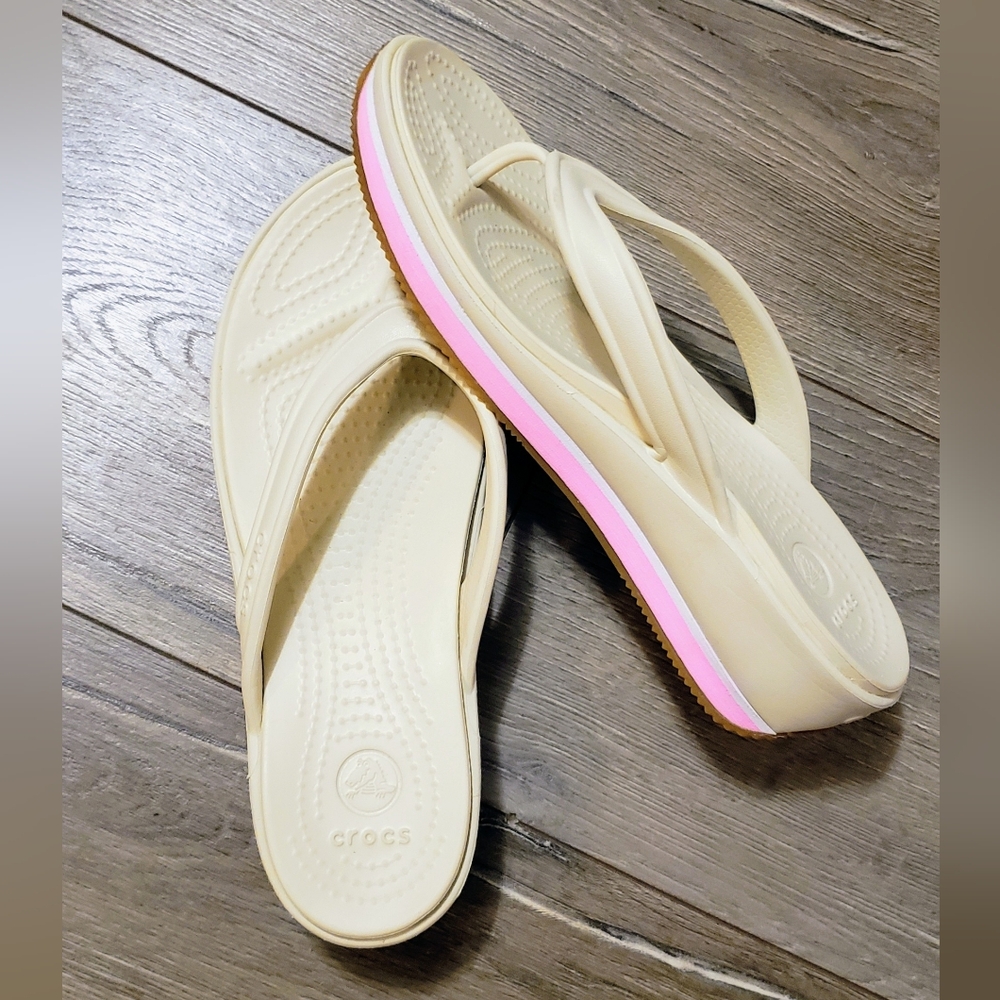Crocs Women's Cream Flip Flops with Pink Accent. W9